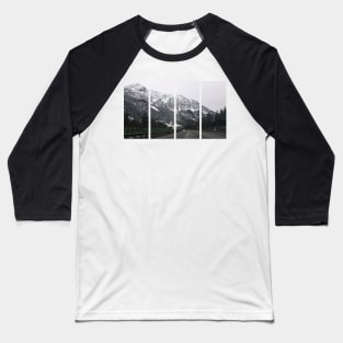 A shot on the move from the windshield of an electric car with a snow-covered alps mountain in front of it in a cold cloudy winter day. POV first person view shot on a mountain highway. Baseball T-Shirt